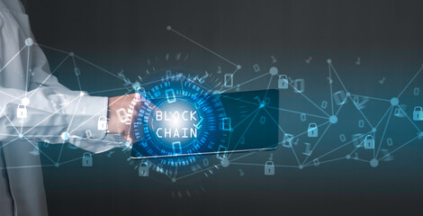 Blockchain technology concept, Businessman holding tablet and touch on screen, Binary code with connect digital technology line blue background.