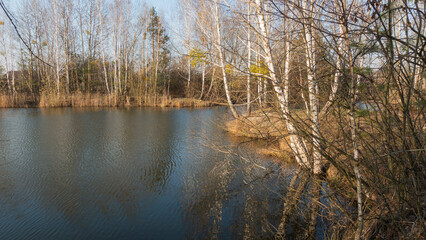 Spring sunset on a village lake