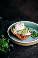 Breakfast. Sandwich with cream cheese, avocado, cucumber and poached egg