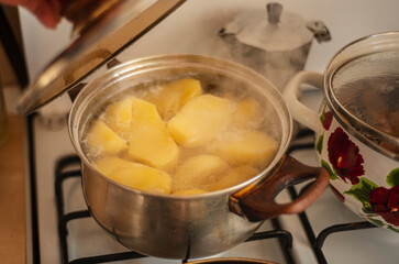boiling potatoes in a saucepan, boiling potatoes on the stove