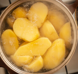 boiling potatoes in a saucepan, boiling potatoes on the stove