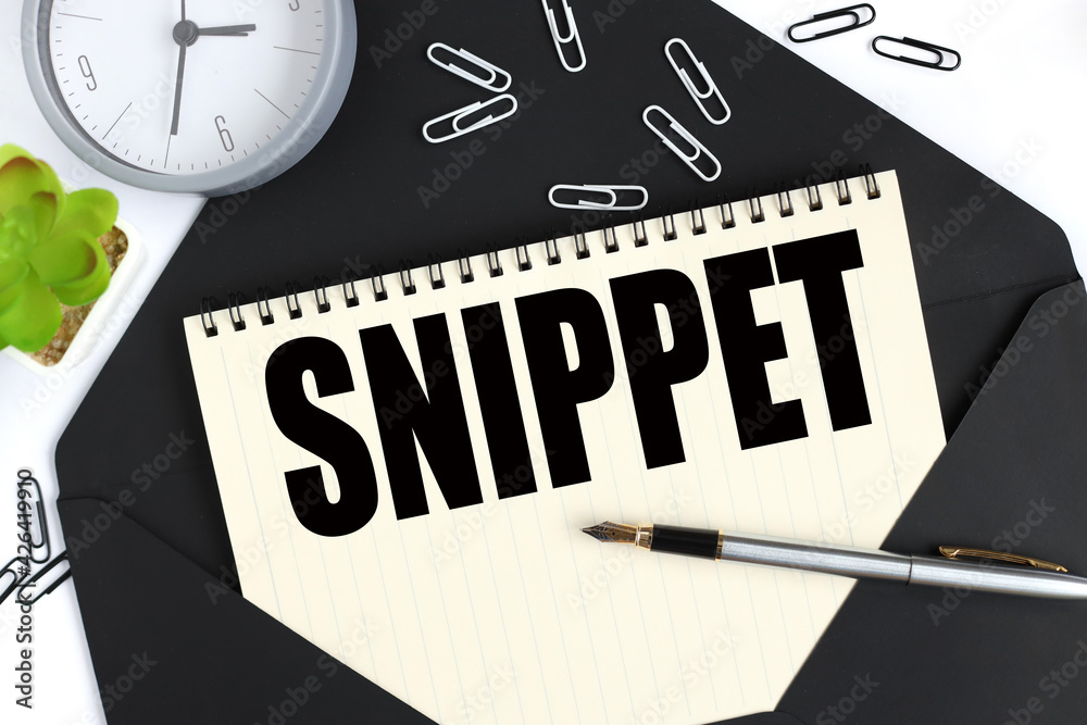 Fototapete snippet. text on a sheet of notepad on a black envelope on a light background