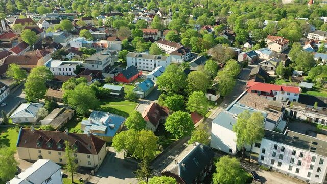 Kuressaare in the Baltic sea,Saaremaa island, Saare County, Estonia. Beautiful 4K panoramic aerial video from flying drone to Kuressaare (Arensburg) city and Lawrence of Rome church a sunny summer day