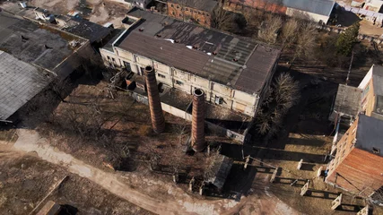 Fototapeten Verlassene Gebäude Abandoned industrial area. Old brick buildings and factory chimneys. Aerial photography.  © f2014vad