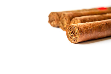 Group of brown cuban cigars isolated on white