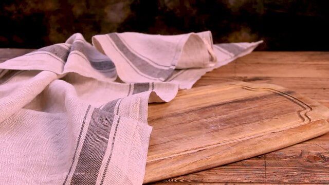 Close up of wooden board and kitchen towel