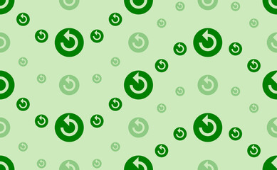 Seamless pattern of large and small green replay media symbols. The elements are arranged in a wavy. Vector illustration on light green background