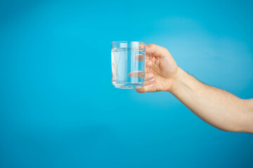 hand holding a Glass of pure water isolated