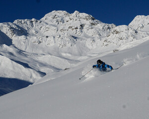 skiers on the top of mountain