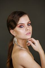 Obraz premium girl with bright makeup and big earrings