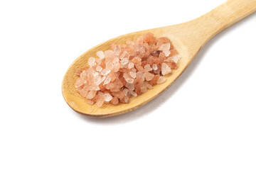 Fototapeta na wymiar Himalayan pink salt on a wooden spoon isolated over white background