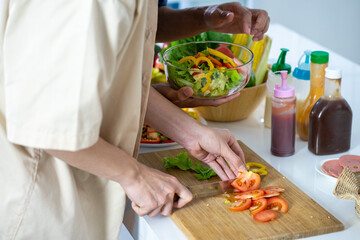 Asian young men lover LGBTQ cooking in the kitchen work from home 