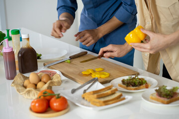 Asian young men lover LGBTQ cooking in the kitchen work from home 
