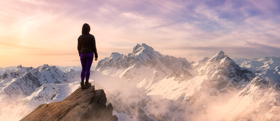Fantasy Adventure Composite with a Girl on top of a Mountain Cliff with Dramatic Landscape in...