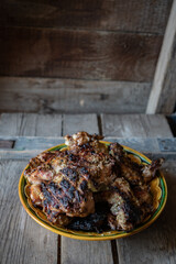 Turkey fillet in batter in a ceramic bowl on the wooden table, low key