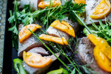 Fototapeta na wymiar Homemade zander fish with vegetables and herbs