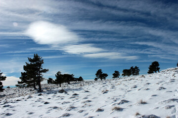 Snowy mountain on a sunny and windy morning