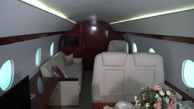 Interior cabin of private luxury vip jet. Inside of airplane plane. High quality 4k footage