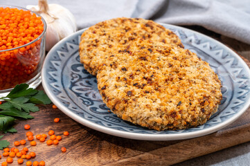 Healthy vegetarian or vegan food, meat free burger made from orange lentils legumes