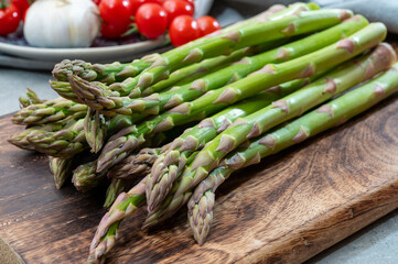 Bunch of fresh ripe green asparagus vegetables ready to cook or grill