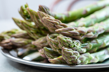 Bunch of fresh ripe green asparagus vegetables ready to cook or grill