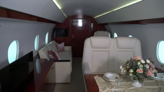 Interior cabin of private luxury vip jet. Inside of airplane plane. High quality 4k footage