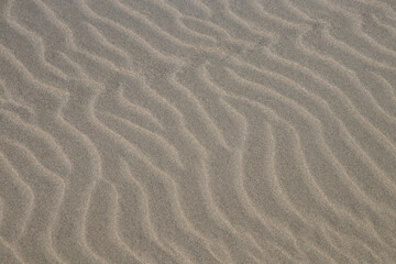 Fototapeta na wymiar Rippled Beach Sand at a Coastal Location