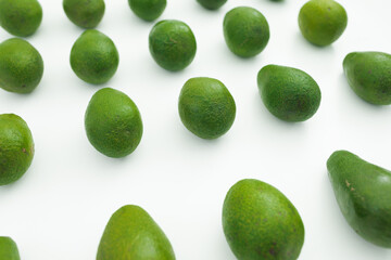 Avocado pattern on white background. Flat lay, top view. Food concept.