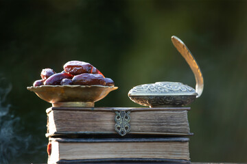 Ramadan kareem background with Quaran, censer and dates.