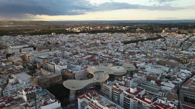 Aerial drone shot of Seville, the capital city of Spain's Andalusia region. Also seen here is a public art structure known as "Las Setas".