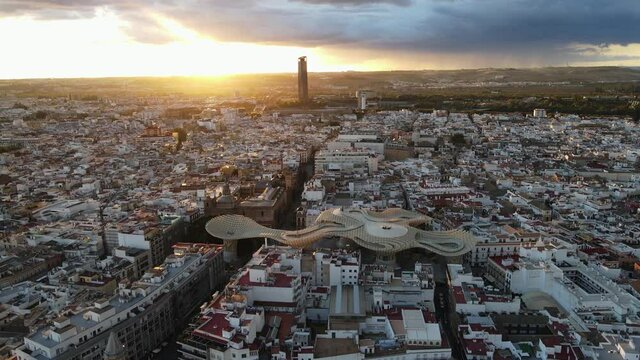Aerial drone shot of Seville, the capital city of Spain's Andalusia region. Also seen here is a public art structure known as "Las Setas".