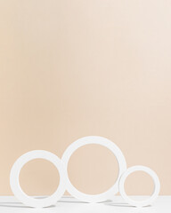 White circles on beige background