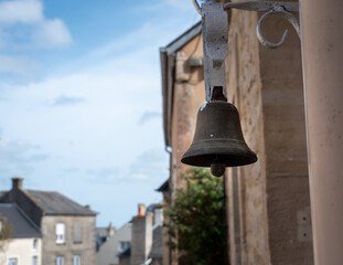 Port-en-Bessin-Huppain, France, March 2021. Old ringtone, bell before entering the house, photo close up