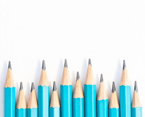 Blue sharp pencils row isolated on white background with copy space on top. Back to school concept