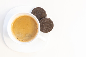 Cup of coffee on saucer with cookies isolated on white background and copy space for text