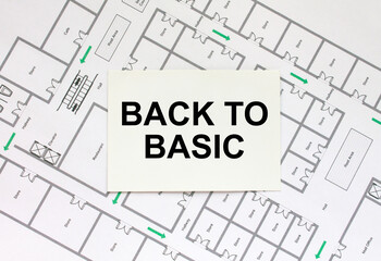 Business card with text Back To Basic on a construction drawing