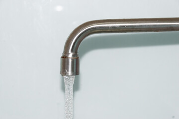 Open sink, faucet, chrome, blurred background