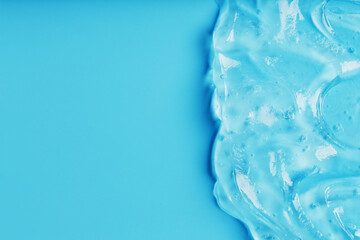 Antiseptic gel on a blue background in waves.