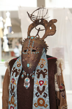 Mask. Decorative mask and dress in traditional national folk style of Russian north. Ethnic fashion, ornate costume with ornamental mask. Traditions of Russian north