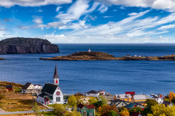 Aerial view of a small town on the Atlantic Ocean Coast. Dramatic Colorful Blue Sky Art Render. Taken in Trinity, Newfoundland and Labrador, Canada.