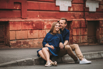 Fototapeta na wymiar Portrait of emotional young couple hugging each other tightly, boyfriend and girlfriend, love you so much, strong affection in relationship