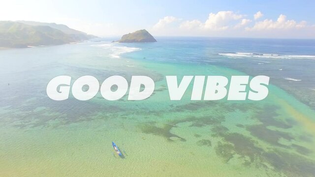 Animation of the words good vibes written in white letters over sunny blue sky and clear ocean