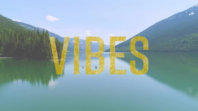 Animation of the word vibes written in yellow letters over tranquil lake and countryside view