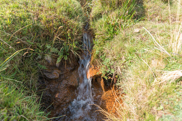 crystal clear water flowing on the mountain