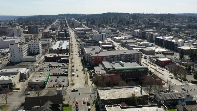 Cinematic aerial drone clip of downtown Everett, Bayside, Port Gardner, Naval Station Everett suburbs, bedroom communities North of Seattle on the shores of Puget Sound in Washington