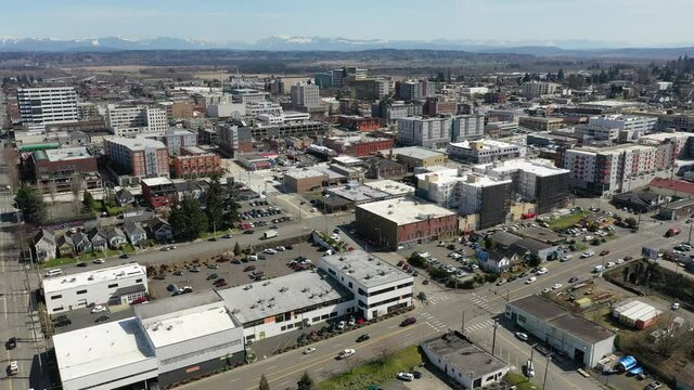 Cinematic aerial drone shot of downtown Everett, Bayside, Port Gardner, neighborhoods near the Boeing Everett Factory, bedroom communities North of Seattle on the shores of Puget Sound in Washington