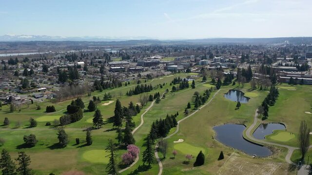 Cinematic aerial drone clip of Northwest Everett, Everett Community College, Legion Memorial Golf Course and nearby bedroom communities North of Seattle by Puget Sound in Washington