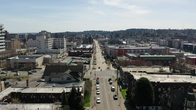 Cinematic aerial rise and reveal drone clip of downtown Everett, Bayside, suburbs, bedroom communities North of Seattle on the shores of Puget Sound in Washington