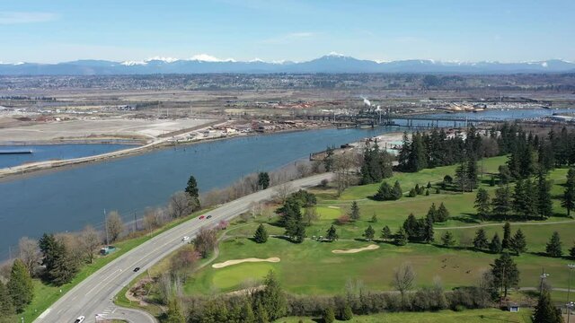 Cinematic aerial drone clip of Northwest Everett, Delta Junction with the Snohomish River, Legion Memorial Golf Course the Cascade Range North of Seattle by Puget Sound in Washington