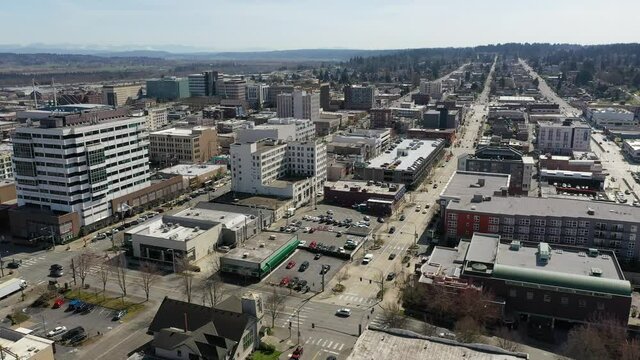 Cinematic drone trucking clip of downtown Everett, Bayside, Port Gardner, neighborhoods near the Boeing Everett Factory, bedroom communities North of Seattle on the shores of Puget Sound in Washington